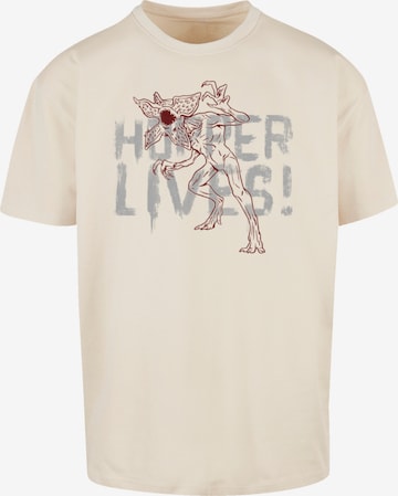 F4NT4STIC T-Shirt 'Stranger Things Hoppers Live Netflix TV Series' in Beige: predná strana