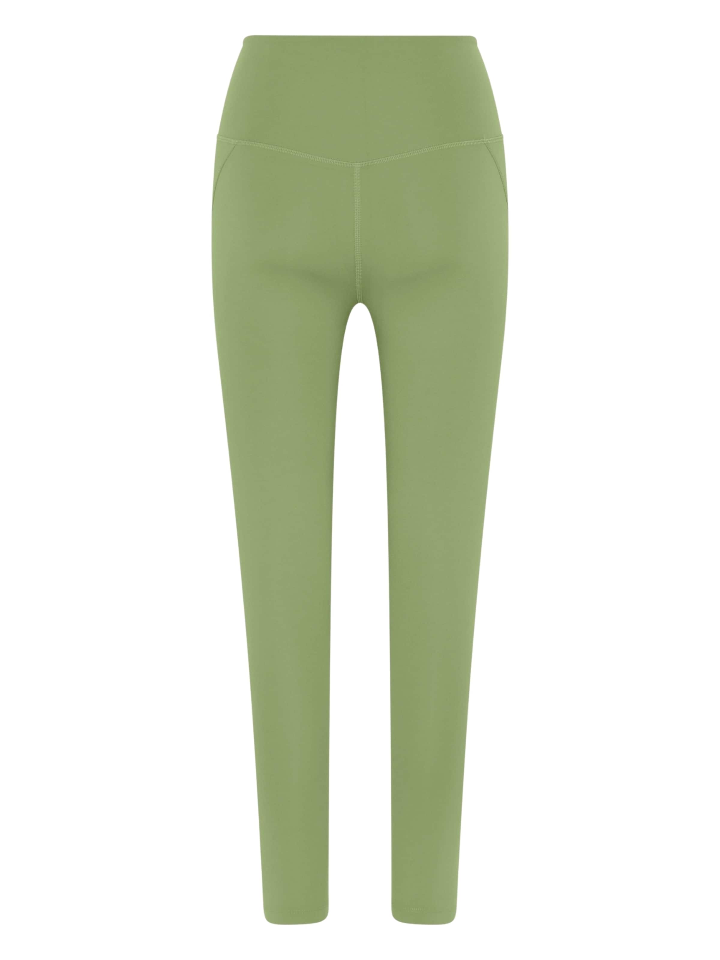 Skinny Pantaloni sportivi di Girlfriend Collective in verde