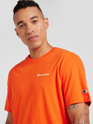 Maglietta di Champion Authentic Athletic Apparel in arancione