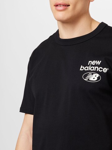 new balance قميص بلون أسود