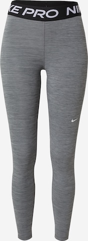 NIKE - Skinny Calças de desporto em cinzento: frente