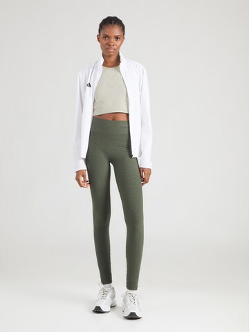 Skinny Pantaloni sport 'Focus' de la Hummel pe verde