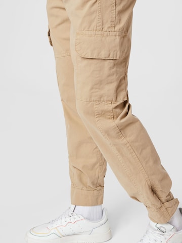 Urban Classics Tapered Cargo Pants in Beige