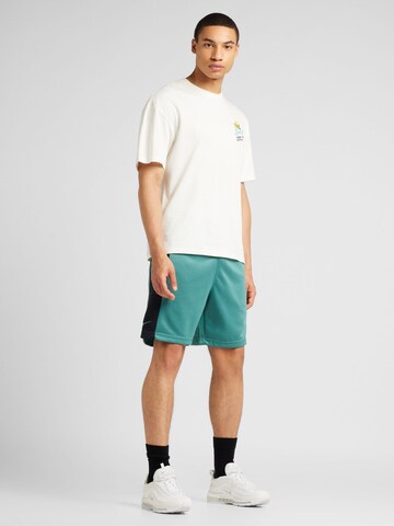 Regular Pantalon 'AIR' Nike Sportswear en vert