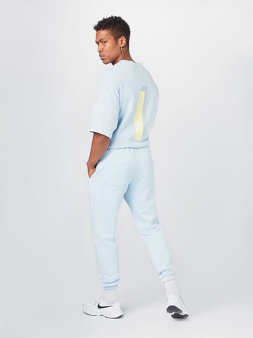 ABOUT YOU x Mero Loose fit Pants 'Code' in Blue