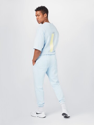 ABOUT YOU x Mero Loosefit Broek 'Code' in Blauw