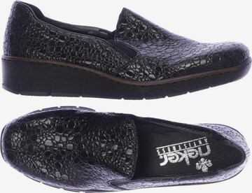 Rieker Flats & Loafers in 39 in Black: front