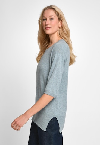 Pull-over include en vert