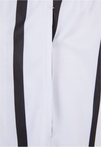 regular Pantaloni di Karl Kani in bianco