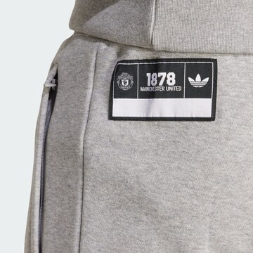 ADIDAS ORIGINALS Tapered Trousers 'Manchester United' in Grey