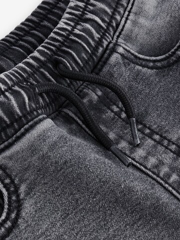 Skinny Jeans di Next in grigio