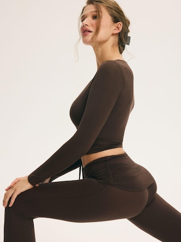 Flared Pantaloni di ESOTIQ in marrone