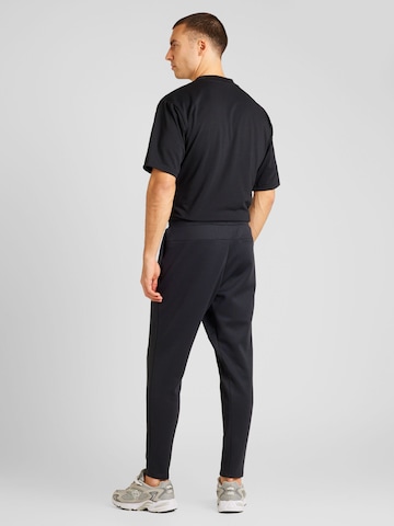 new balance Regular Sports trousers in Black