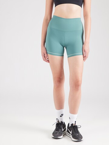Skinny Pantaloni sport 'ONE' de la NIKE pe verde: față