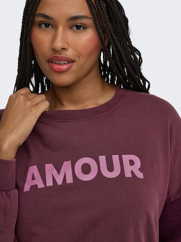 Sweat-shirt 'CAREmelie' ONLY Carmakoma en rouge