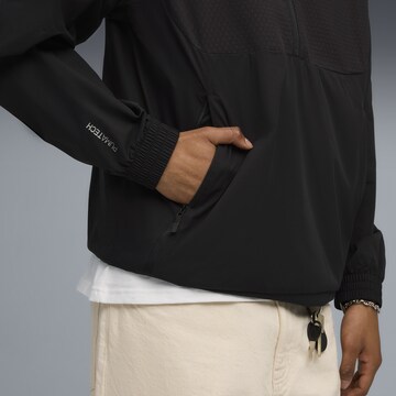 PUMA Sportsweatshirt 'Pumatech' in Zwart