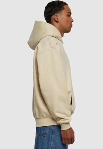 Karl Kani Collegepaita ' Small Signature' värissä beige