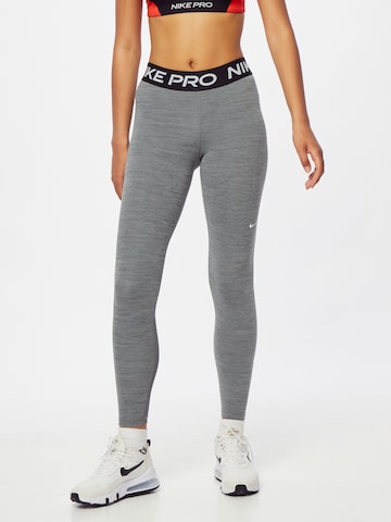 NIKE Skinny Sportbroek in Grijs: voorkant