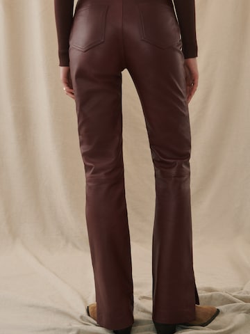 Kendall for ABOUT YOU Boot cut Pants 'Dita' in Brown