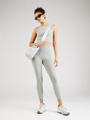 Skinny Pantaloni sportivi di Girlfriend Collective in verde