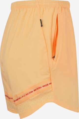 Regular Pantalon de sport NIKE en orange