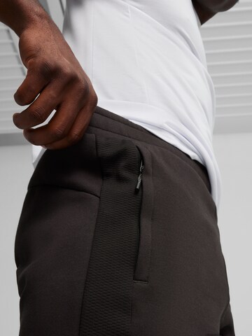 PUMA Normalny krój Spodnie sportowe 'Evostripe' w kolorze czarny