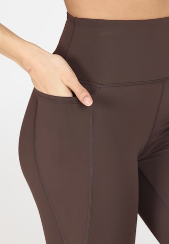 Athlecia Skinny Sports trousers 'Aliya' in Brown