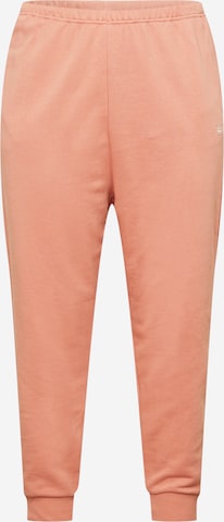 Pantaloni de la Reebok pe bej: față