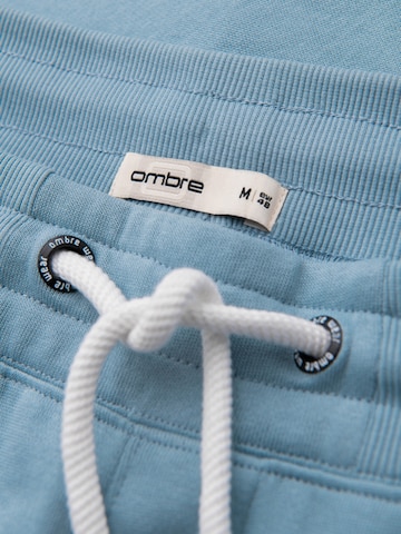 Effilé Pantalon de sport Ombre en bleu