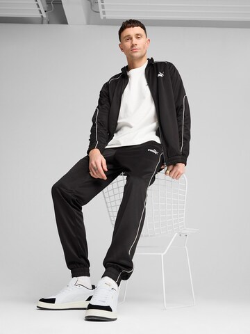 PUMA Tapered Sports trousers in Black