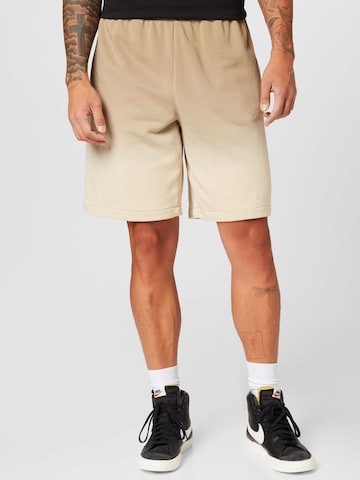 Nike Sportswear - Calças em castanho: frente