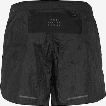Regular Pantalon de sport 'RUN DIV ' NIKE en noir
