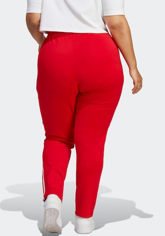 ADIDAS ORIGINALS Loose fit Pants in Red