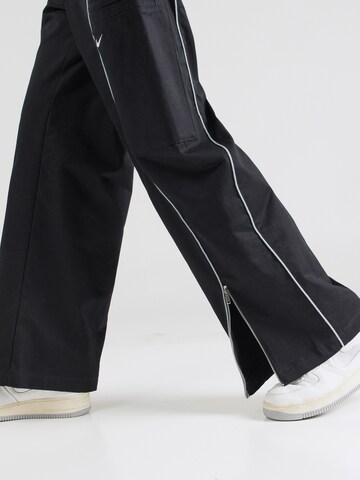 Nike Sportswear Wide leg Trousers 'STREET' in Black