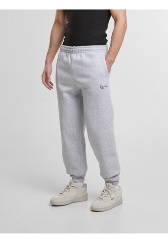 Karl Kani Tapered Pants 'Essential' in Grey: front