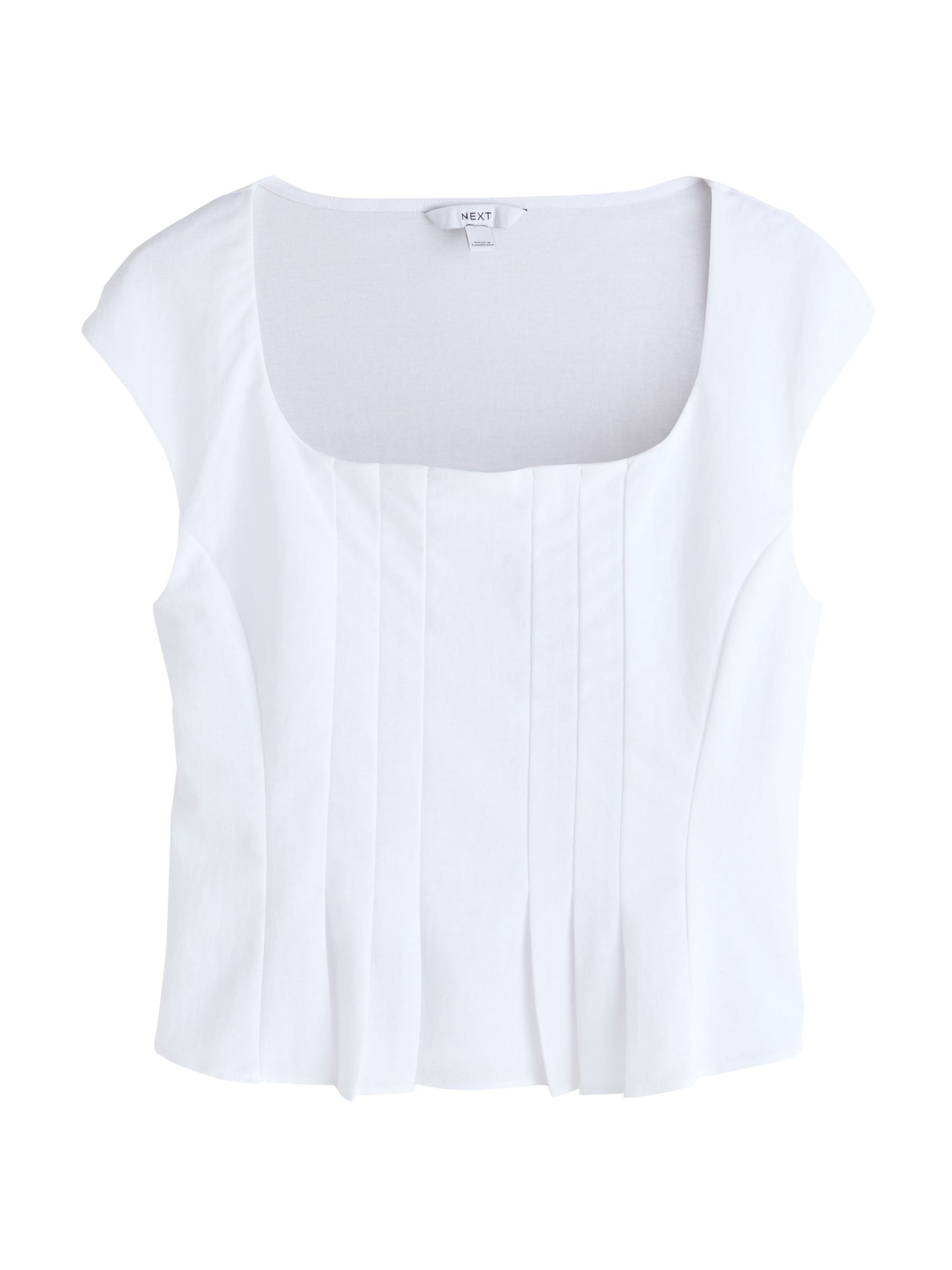 Next Topp i vit: framsida