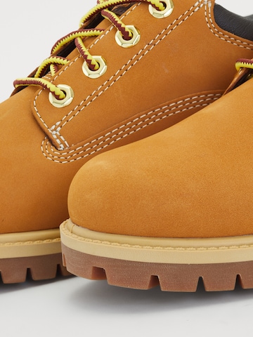 TIMBERLAND Šněrovací boty 'HERITAGE' – hnědá