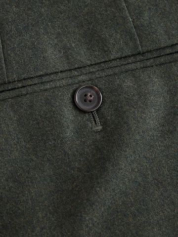 Slimfit Pantaloni con piega frontale di Next in verde