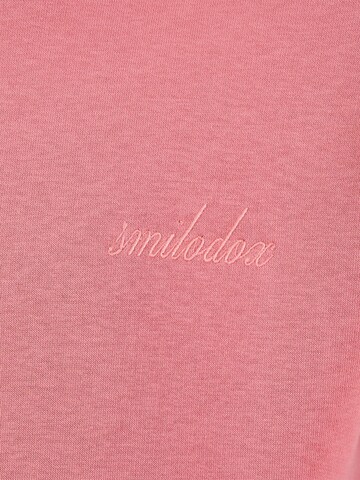 Veste de survêtement Smilodox en rose