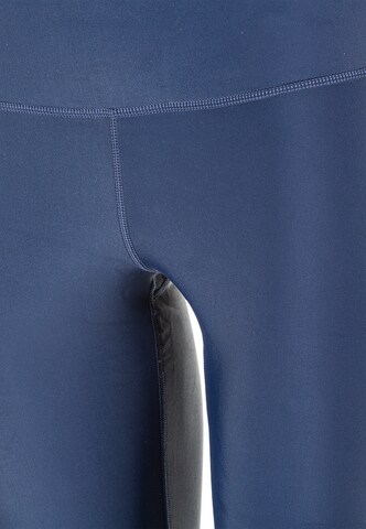 Athlecia Skinny Sportbroek 'Cadidell' in Blauw