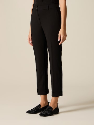 oltre - Tapered Pantalón en negro