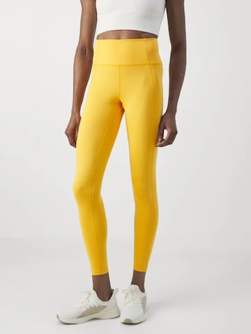 Girlfriend Collective Skinny Sporthose in Gelb: Vorderseite