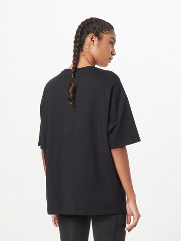 new balance Свободна дамска риза 'Essentials' в черно
