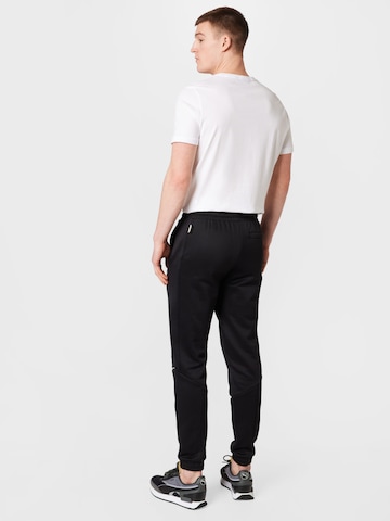 PUMA Tapered Sportbroek 'King' in Zwart