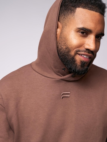 Pullover 'Essential Oversized Hoodie' di Fortex Fitness in marrone