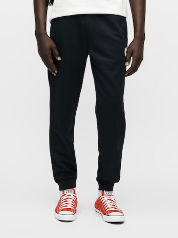 Effilé Pantalon 'RETRO TRACK' CONVERSE en noir : devant