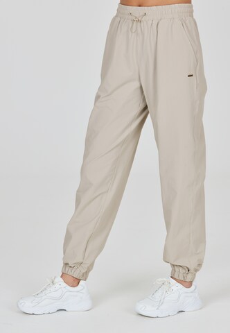 Athlecia Regular Sportbroek 'Hero' in Beige: voorkant