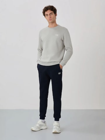 Survêtement Tommy Life en bleu : devant