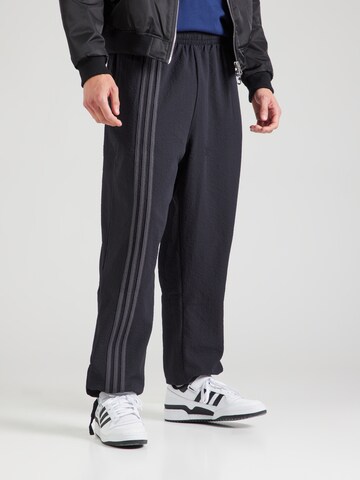 ADIDAS ORIGINALS Свободный крой Штаны 'Firebird' в Черный: спереди