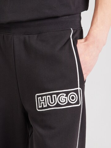 Tapered Pantaloni 'Noiderpant' di HUGO in nero